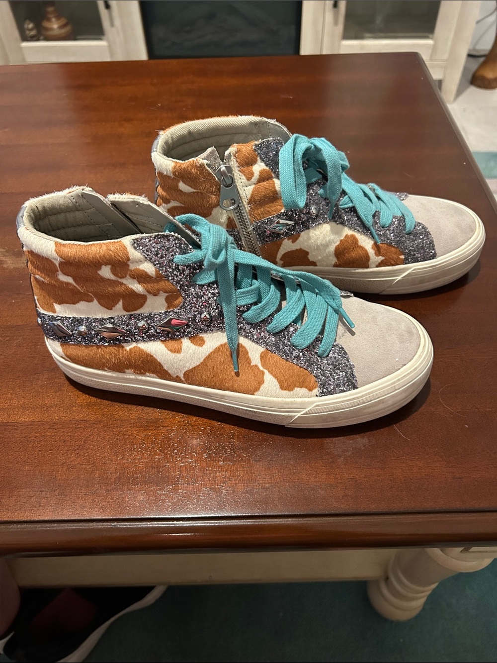 Gianni Bini Cow Print High-Top Sneakers with Turquoise Laces